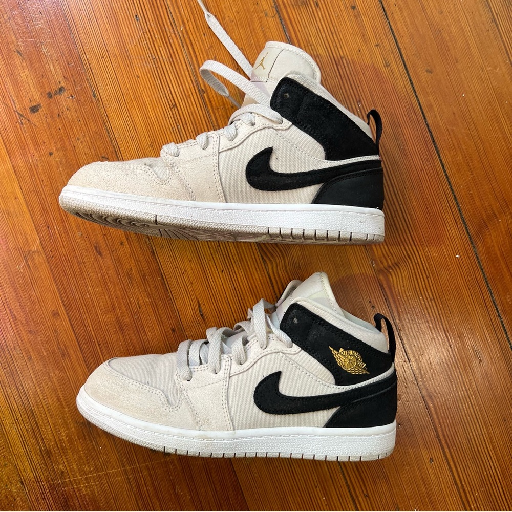 Air Jordans in Black and Grey with Gold Stamp